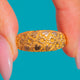 18ct Gold keeper ring, raised flowers and heart motifs from the front