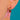 Close-up worn view of round Garnet stud and pear-shaped drop