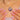 Close neckline view of the painted pansy pendant